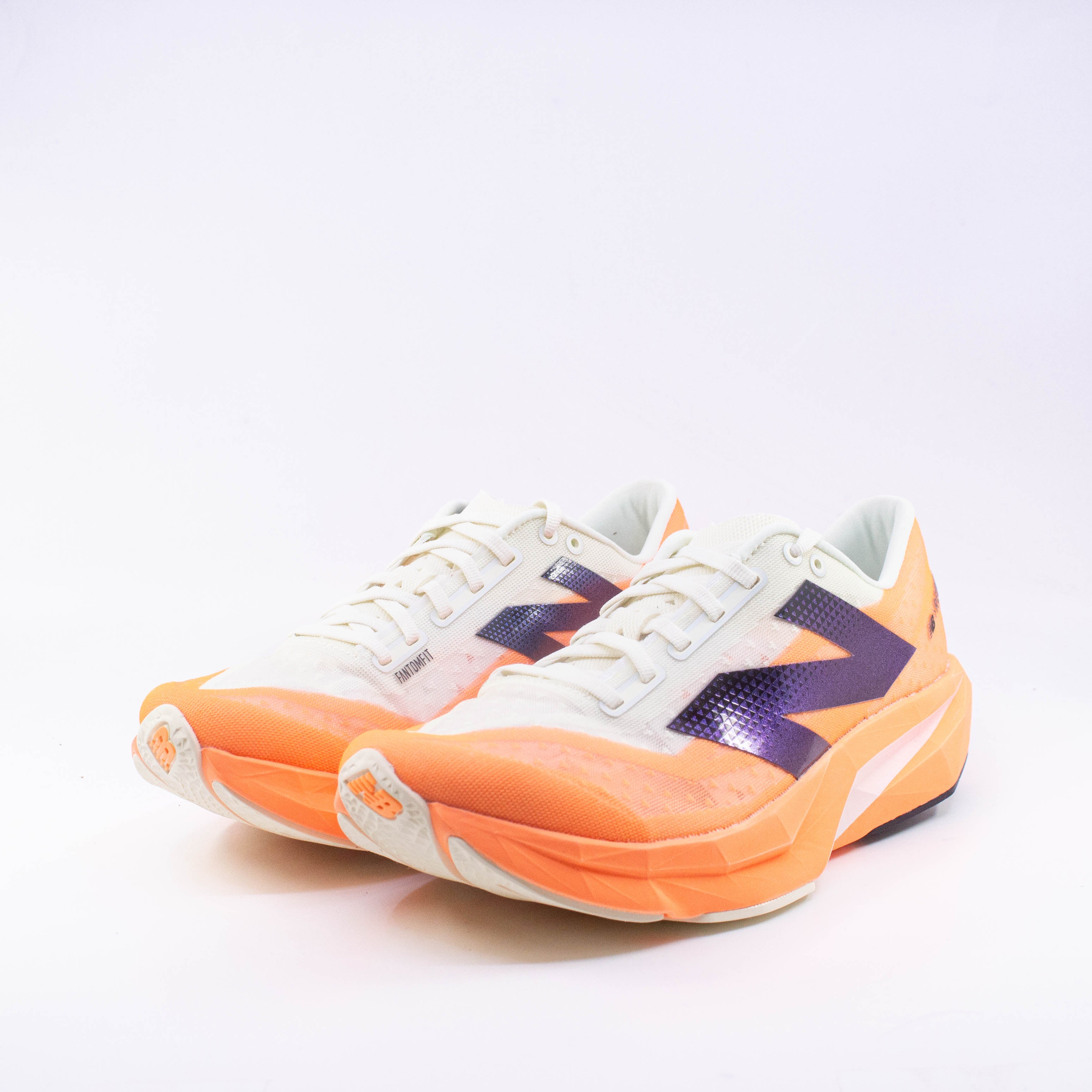 New Balance Fuelcell Rebelv4 (B Standard) Womens Hot Mango with Angora and Black - Frontrunner Colombo